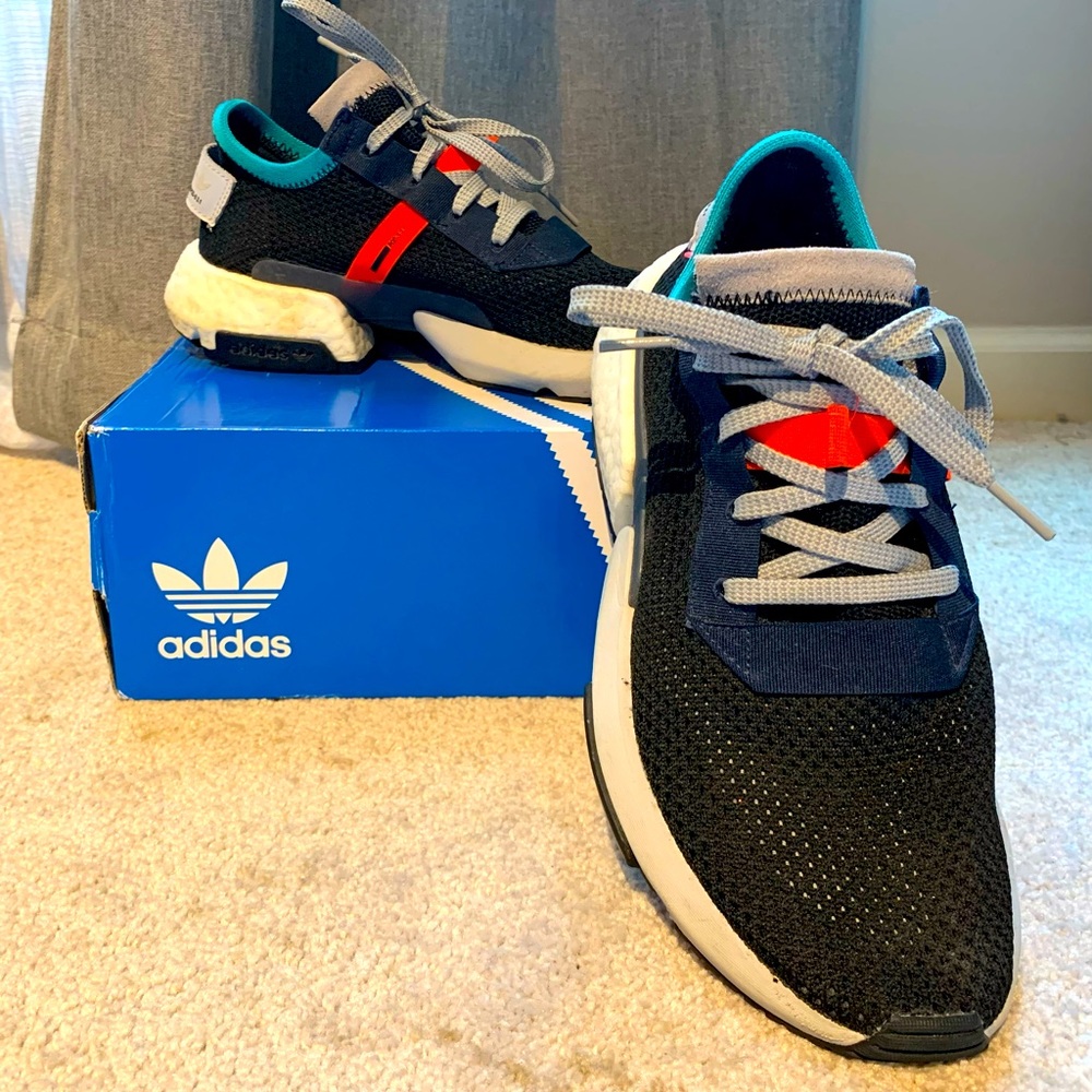 Black adidas with orange/blue accents.